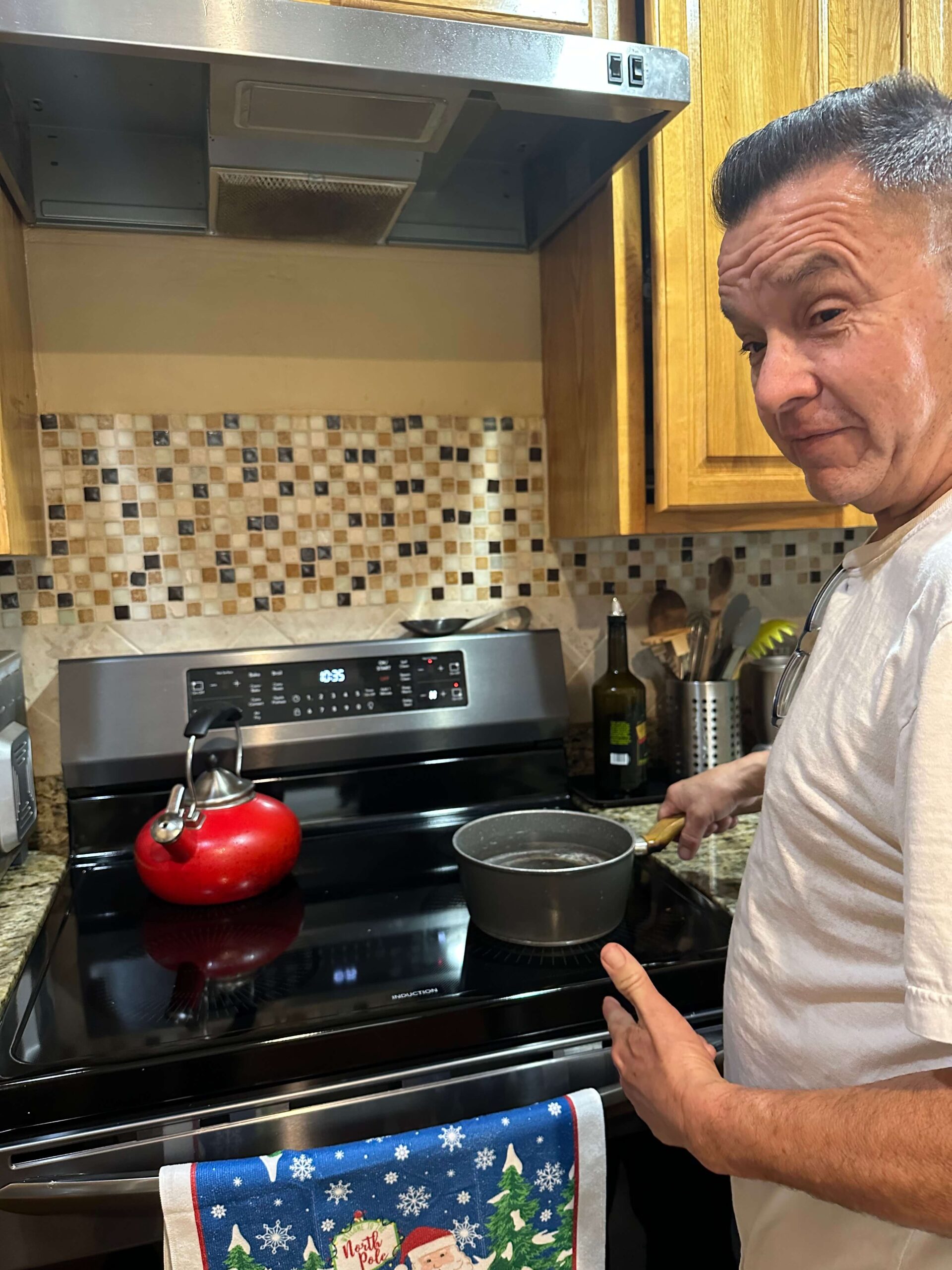 Abel Melendrez cooking on the family's new electric induction stove.