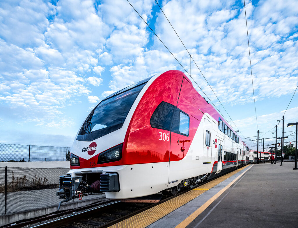 Caltrain's new all-electric commuter train at a station, powered by 100% renewable energy from Peninsula Clean Energy.